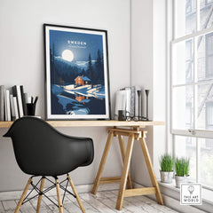 Sweden art print displayed in a stylish home office setting, featuring a vibrant landscape and cozy cabin design.
