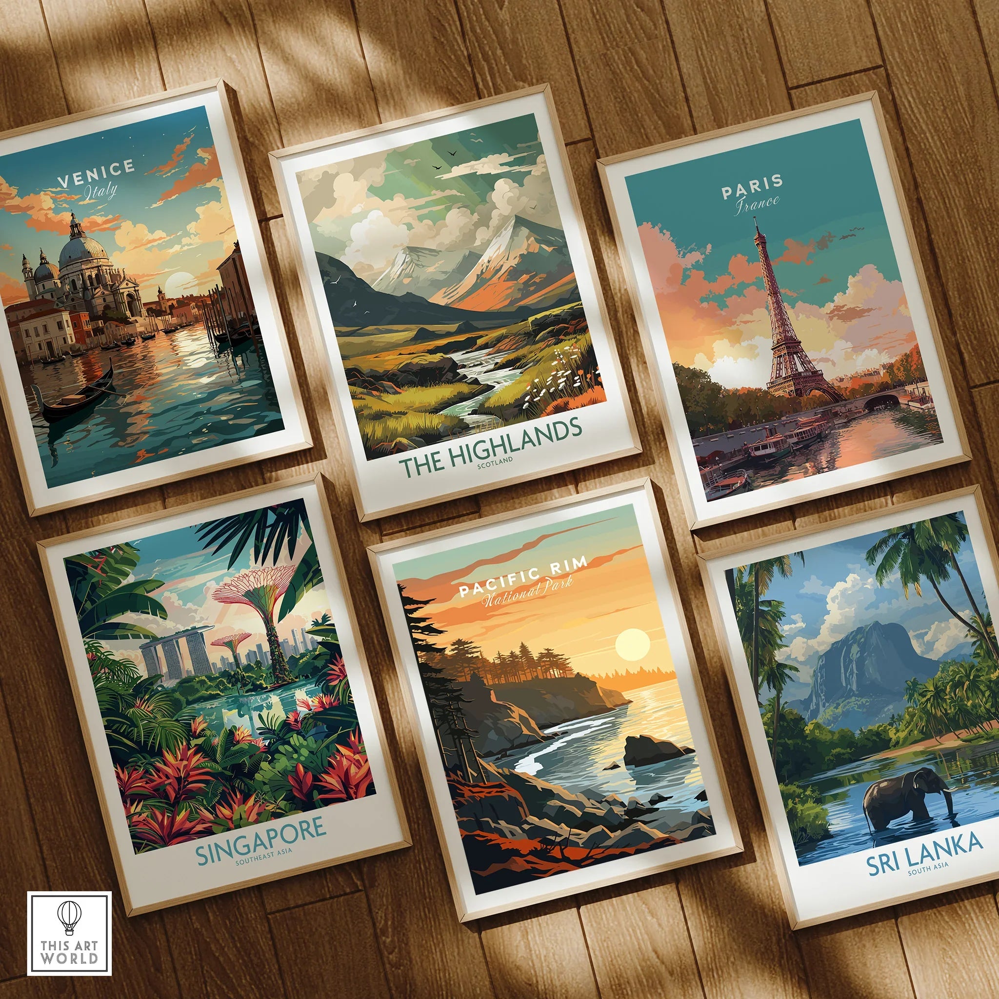 Set of six framed travel art prints featuring Venice, Paris, Singapore, Highlands, Pacific Rim, and Sri Lanka on wooden floor.