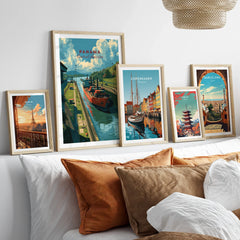 Framed travel posters of Paris, Panama, Copenhagen, Tokyo, and Barcelona for wall art decor