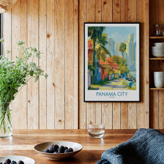 Panama City travel poster with colorful buildings, palm trees, and skyline, framed on wood wall for home decor