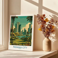 Panama City travel poster with skyline, palm trees, and greenery, displayed on windowsill beside dried flowers