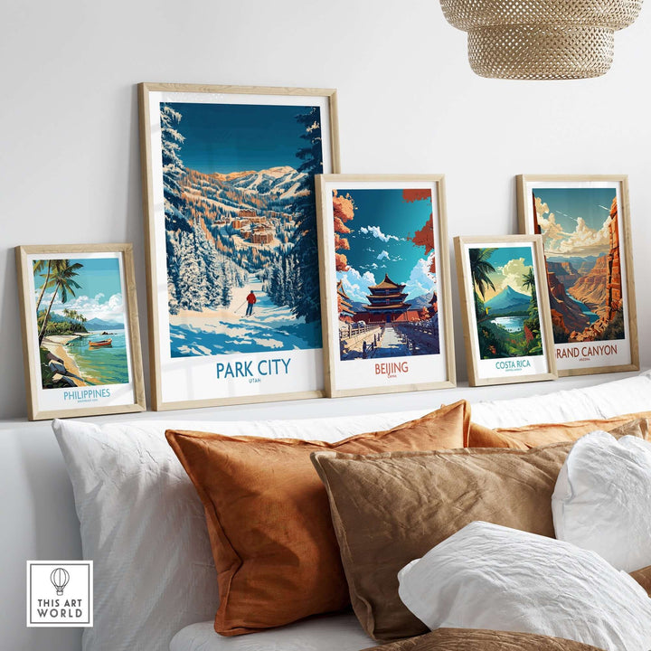 Collection of framed travel prints featuring Park City skiing, Beijing, Costa Rica, and the Grand Canyon on a stylish wall.