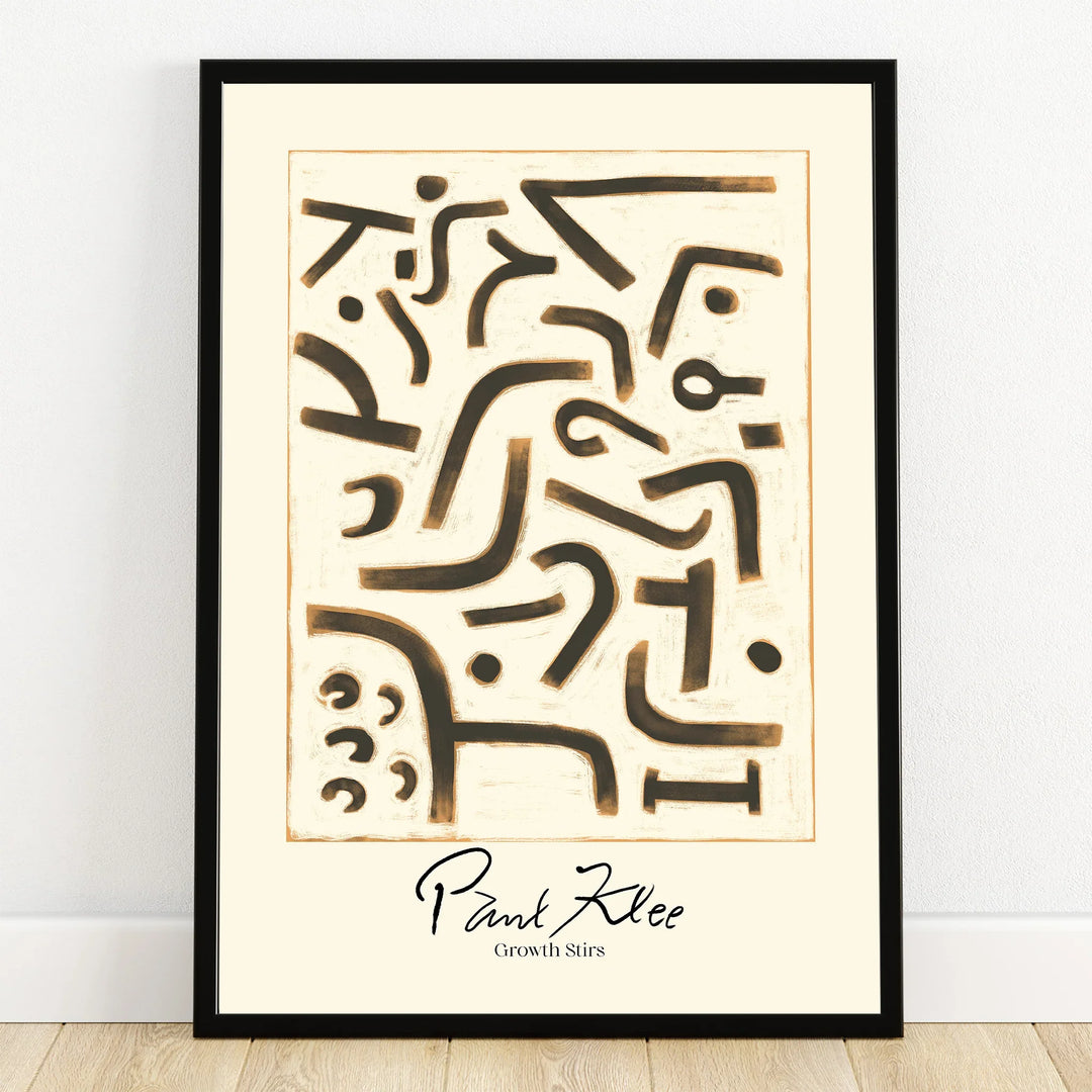Abstract Paul Klee art print with black geometric shapes, black frame, on white wall