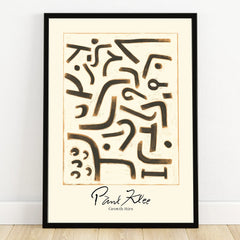 Abstract Paul Klee art print with black geometric shapes, black frame, on white wall