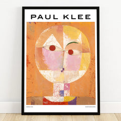 Paul Klee abstract face art print with geometric shapes in a black frame against a wall