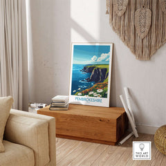 Pembrokeshire Art Print displayed in a cozy interior, showcasing vibrant coastal scenery and intricate details.