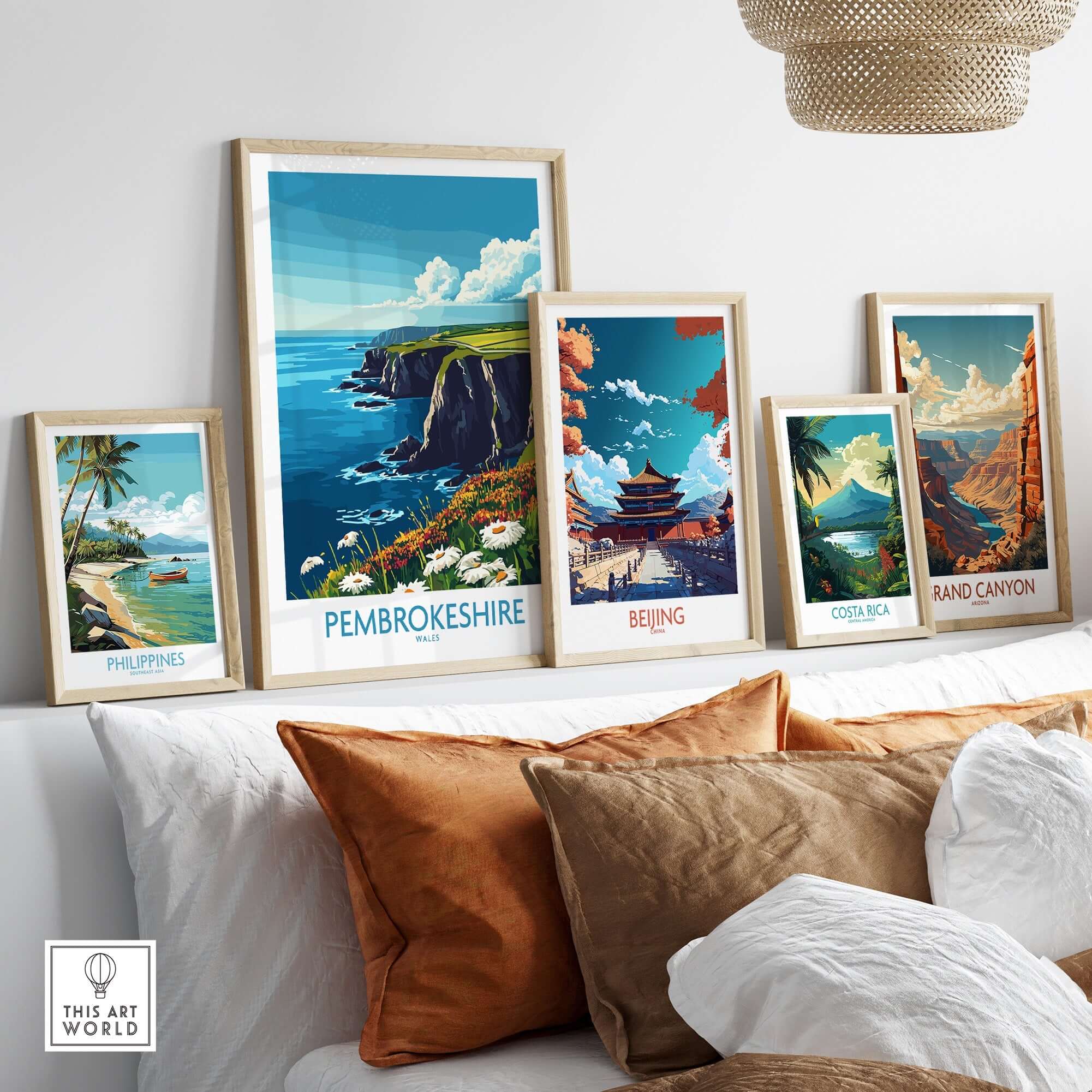Pembrokeshire Art Print displayed among various travel art prints on a stylish home decor shelf.