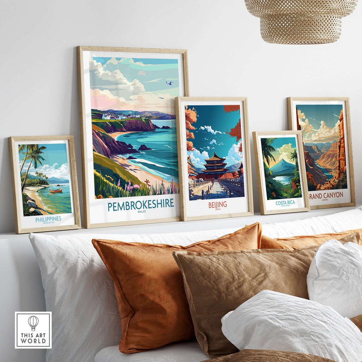 Artistic prints of Pembrokeshire, Philippines, Beijing, and the Grand Canyon showcased in a stylish living room setting.