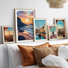 Pembrokeshire Coast Wales Travel Print displayed among other travel prints in a cozy living room setting.