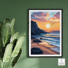 Pembrokeshire Coast Wales Travel Print showcasing a stunning sunset over the coast with palm leaves in the background.