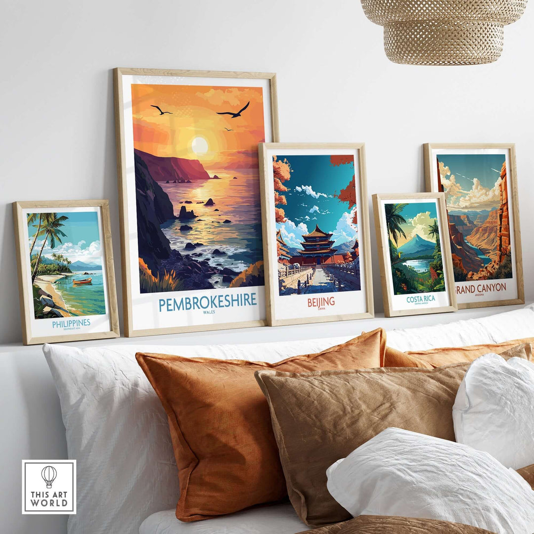 Pembrokeshire Coast wall art print among other travel-themed prints in a stylish interior setting.