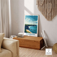 Pembrokeshire Poster Wales displayed in a cozy living room, showcasing the stunning coastline of Pembrokeshire.