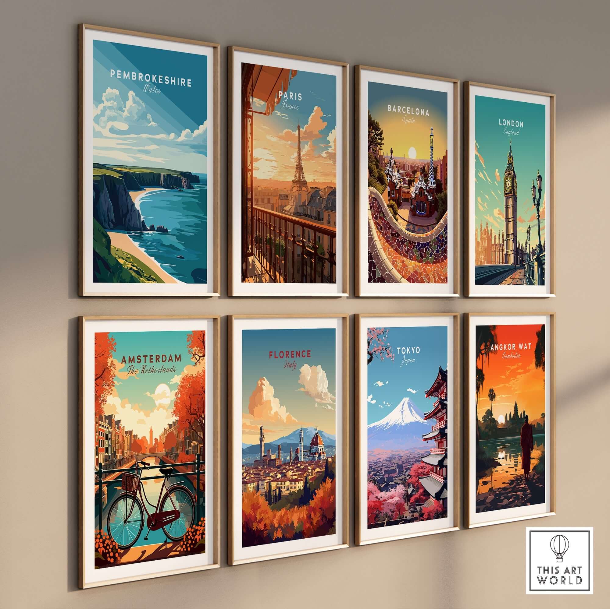 Nine framed art prints featuring landscapes from Pembrokeshire, Paris, Barcelona, London, Amsterdam, Florence, Tokyo, and Angkor Wat.