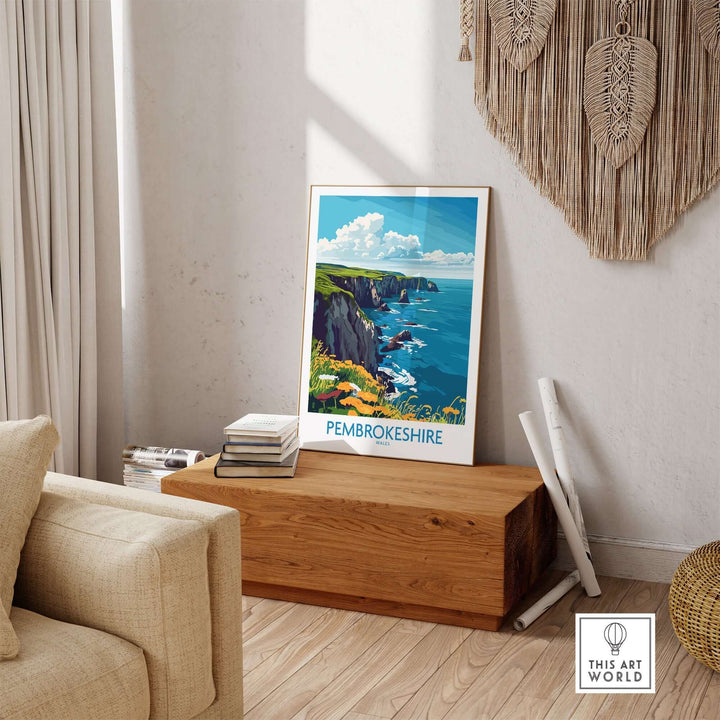 Pembrokeshire travel poster displayed in a cozy interior, showcasing stunning coastal views. Perfect for travel enthusiasts.