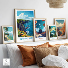Collection of travel posters including Pembrokeshire Travel Poster showcased in a stylish interior setting.