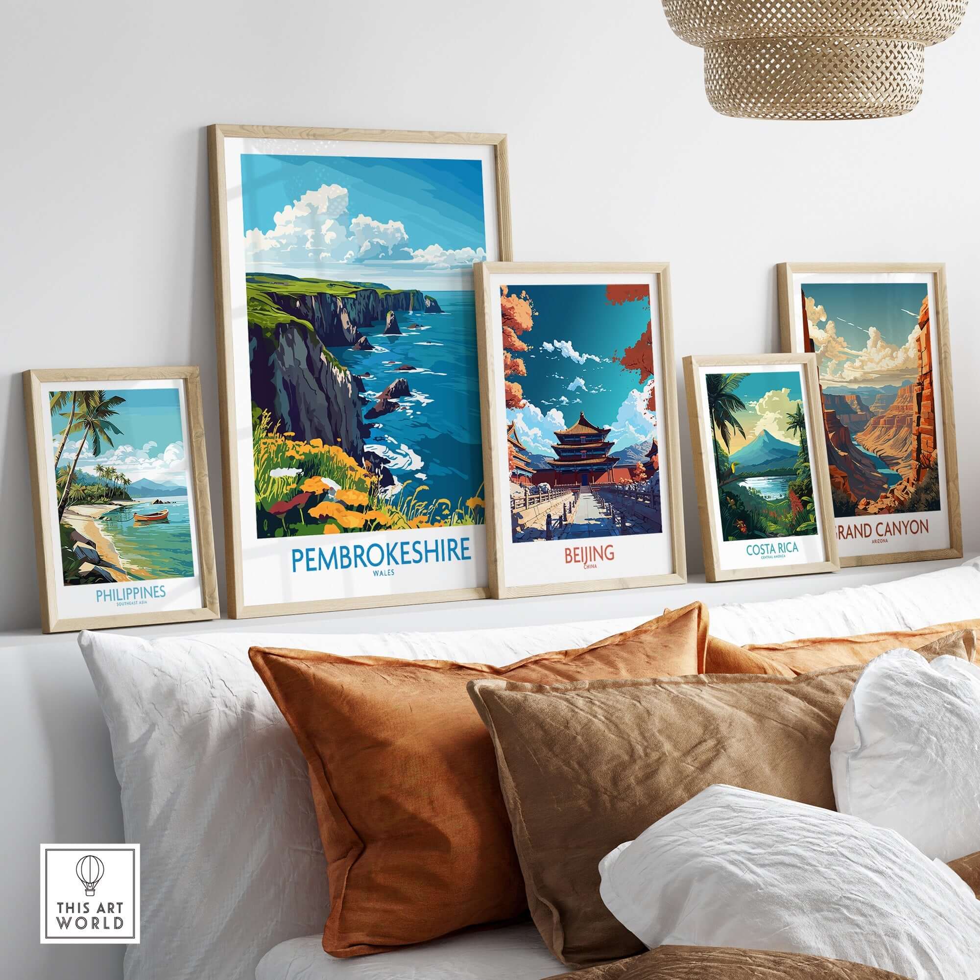 Collection of travel posters including Pembrokeshire Travel Poster showcased in a stylish interior setting.