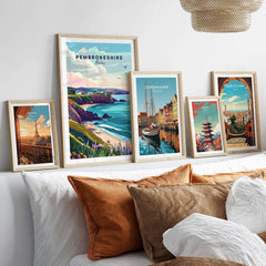 Pembrokeshire Wales Poster displayed among vibrant travel posters in a stylish interior setting.