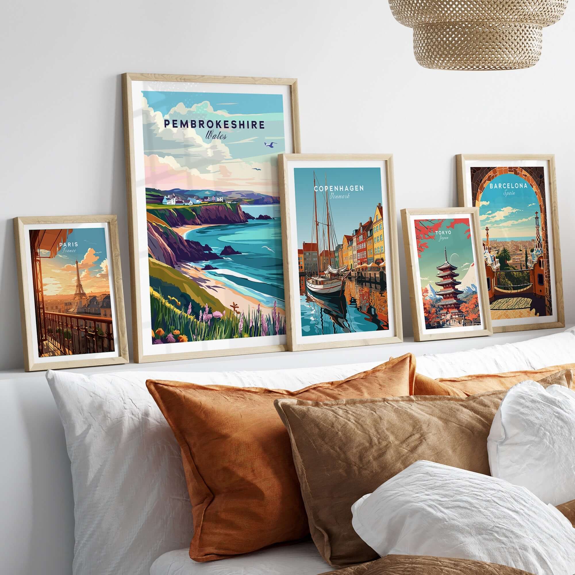 Pembrokeshire Wales Poster displayed among vibrant travel posters in a stylish interior setting.