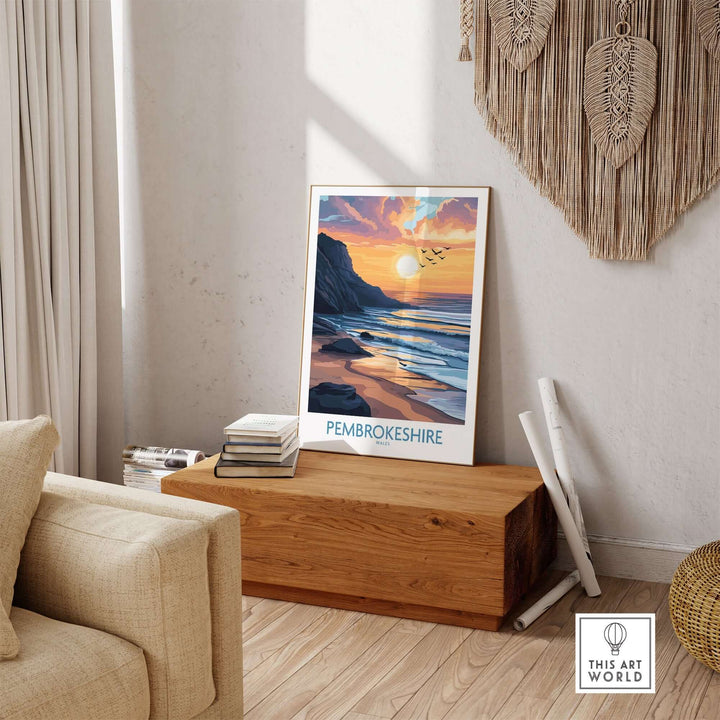 Pembrokeshire Wales travel poster featuring a golden sunset, displayed in a cozy living room setting.