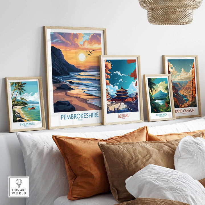 Stylish travel posters featuring Pembrokeshire, Beijing, Costa Rica, and the Grand Canyon displayed in a cozy interior setting.