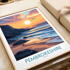 Pembrokeshire Wales Travel Poster featuring a stunning sunset over the coast with waves and birds in the sky.