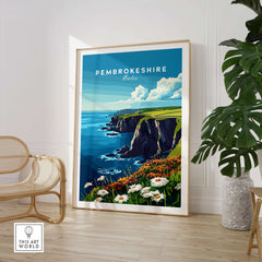Pembrokeshire Wall Art showcasing the stunning Wales coast with vibrant flowers and cliffs in a stylish living room setting.