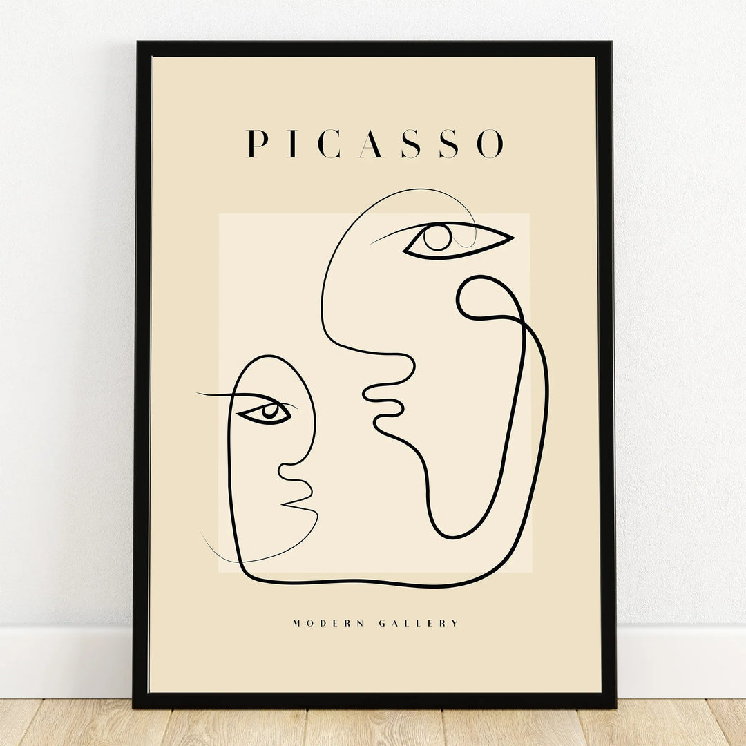 Minimalist Picasso line art print in black frame, abstract faces wall decor