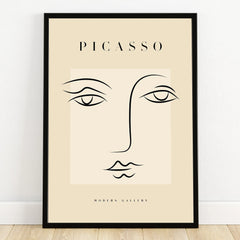 Minimalist Picasso-inspired line art face wall art in black frame, modern home decor print