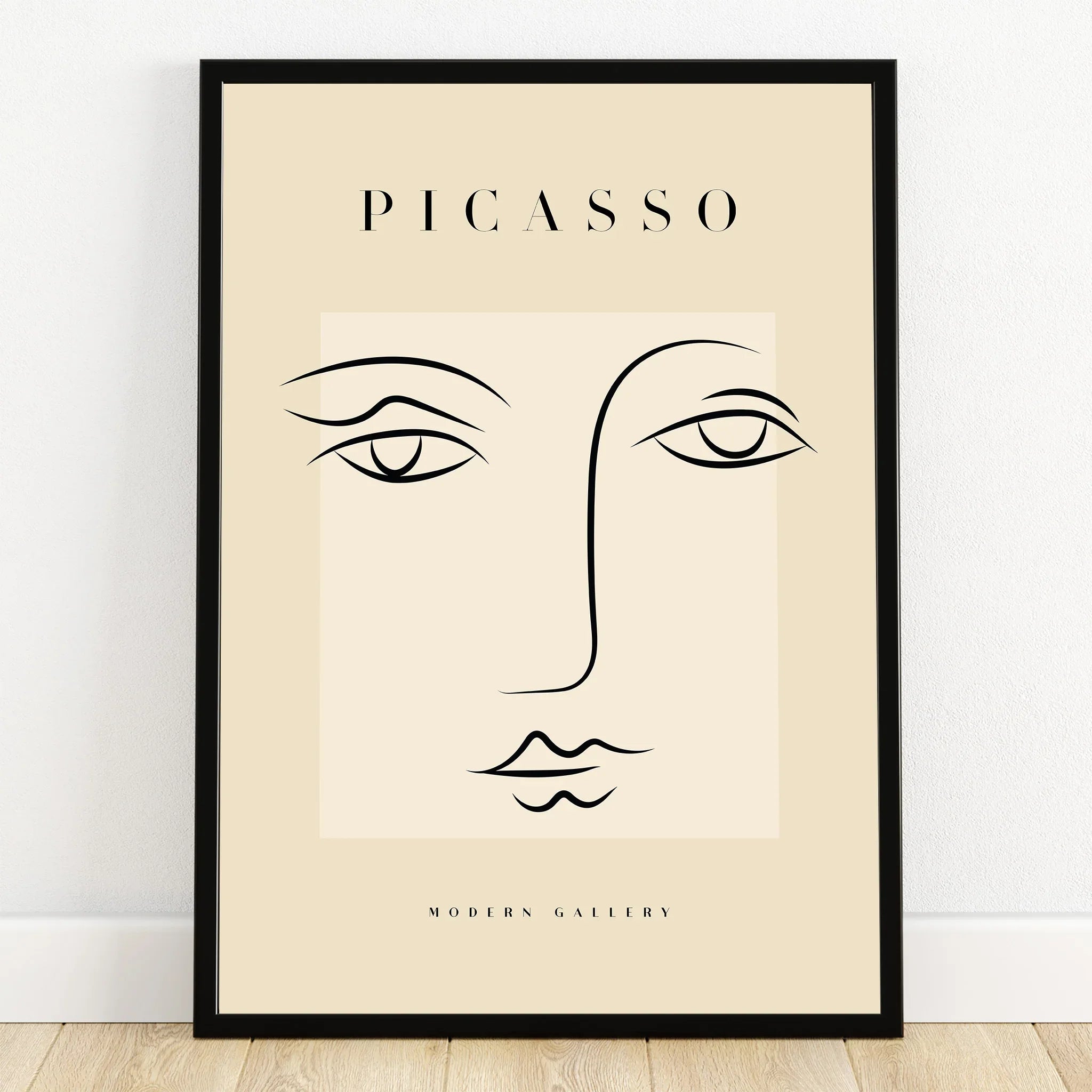 Minimalist Picasso-inspired line art face wall art in black frame, modern home decor print