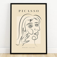 Minimalist Picasso-style line art portrait print in black frame, modern abstract wall art