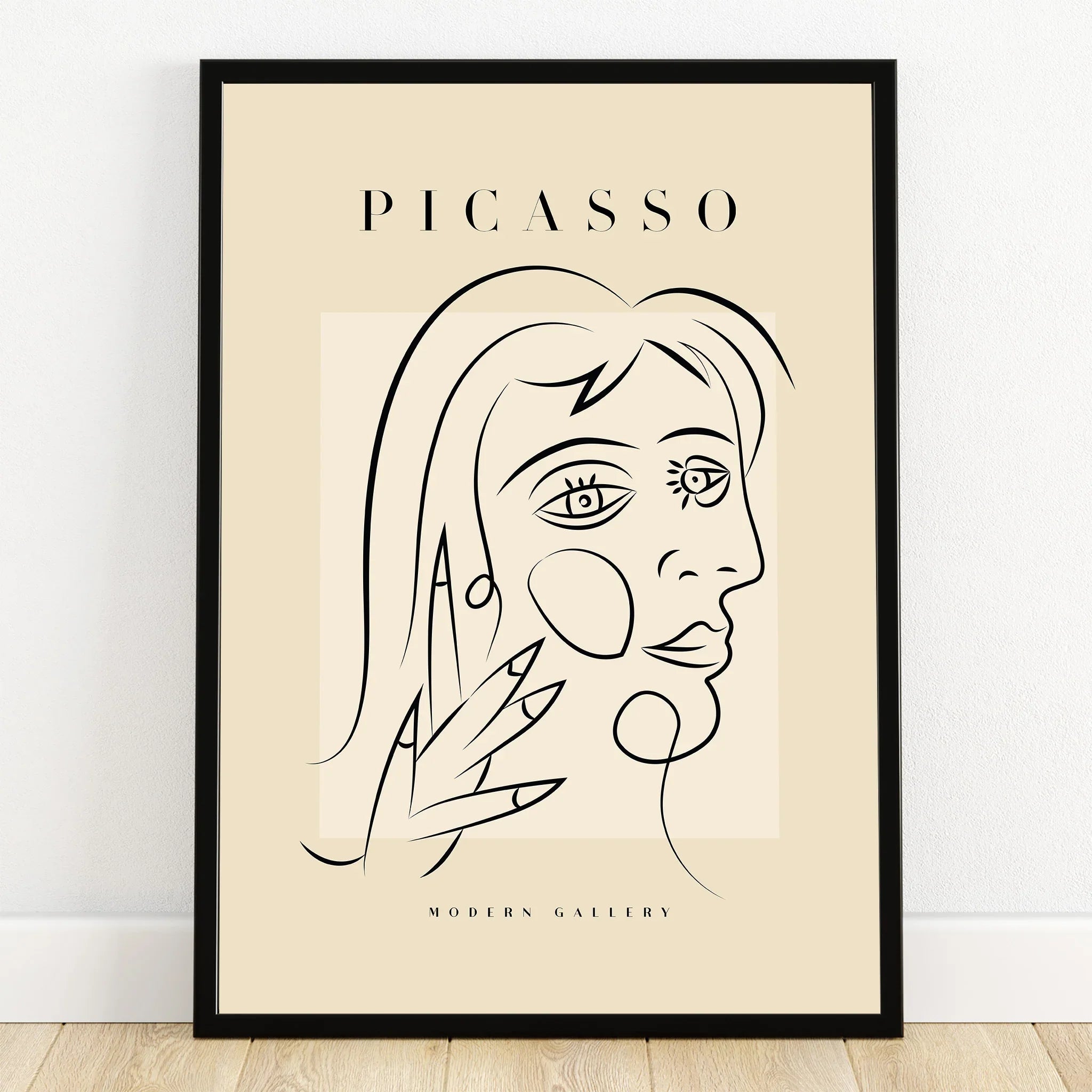 Minimalist Picasso-style line art portrait print in black frame, modern abstract wall art