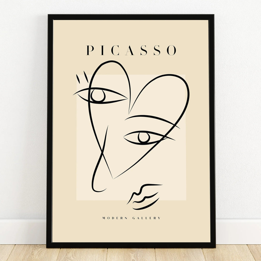 Minimalist Picasso-inspired line art print with black frame, abstract face wall art