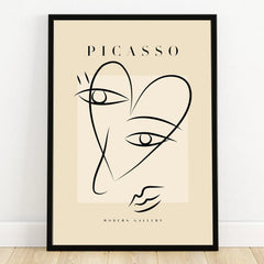 Minimalist Picasso-inspired line art print with black frame, abstract face wall art
