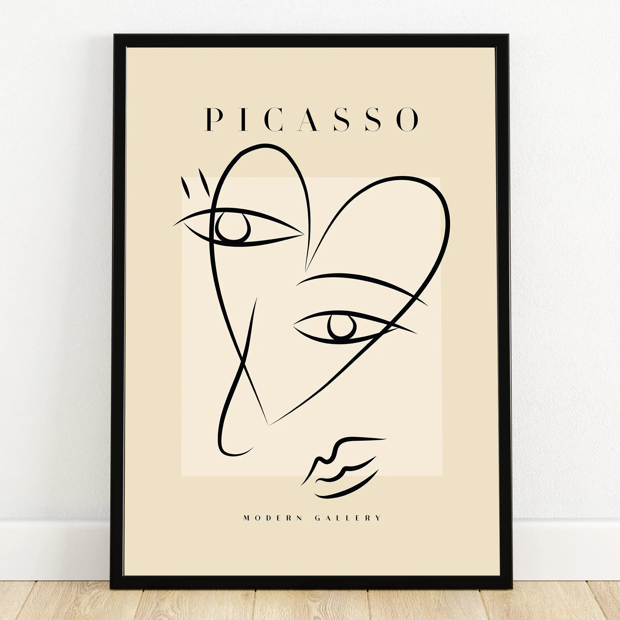 Minimalist Picasso-inspired line art print with black frame, abstract face wall art