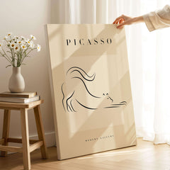 Picasso Stretching Cat Line Art Minimalist Animal Poster Modern Gallery Print Wall Art displayed in bright room with flowers.