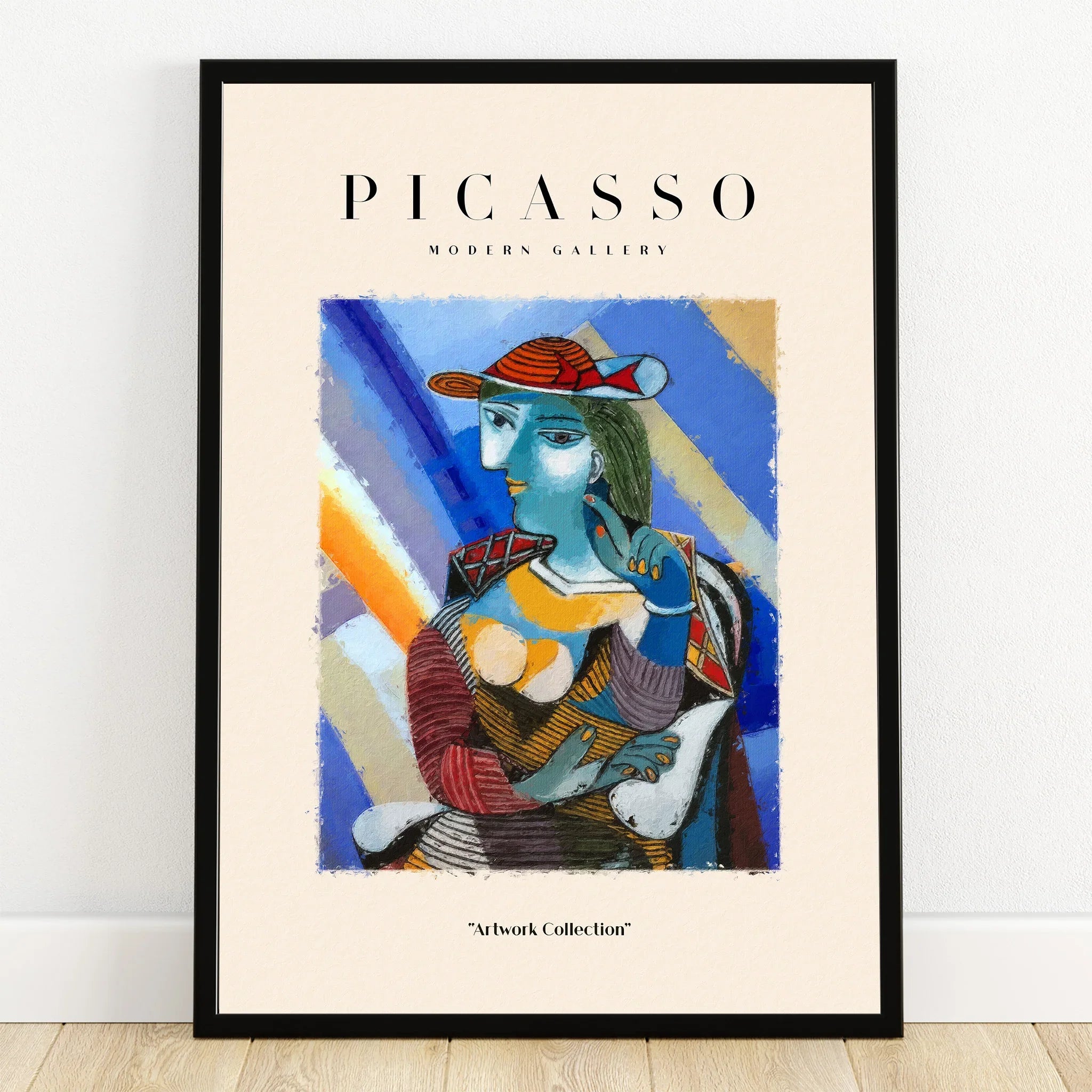 Framed abstract Picasso art print with colorful geometric shapes leaning against a wall