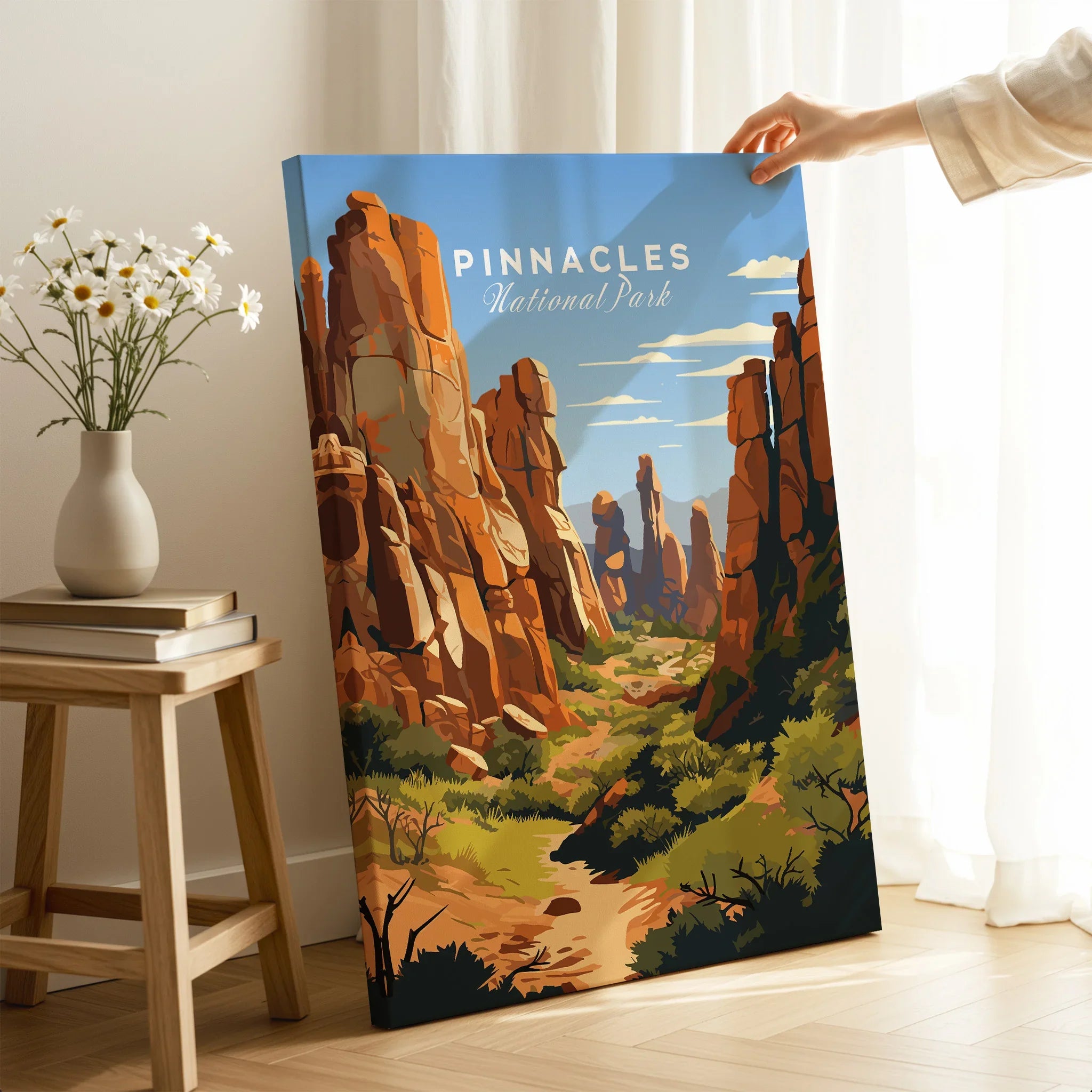 Pinnacles National Park travel poster print held in a modern living room setting