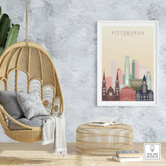 Stylish Pittsburgh skyline wall art print in a cozy home setting with modern decor and a hanging chair.