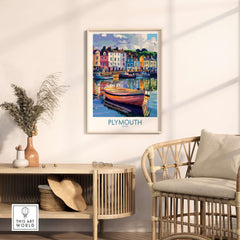 Plymouth England Art - Colorful Boat Scene Print displayed in a stylish interior with wooden furniture and coastal decor.