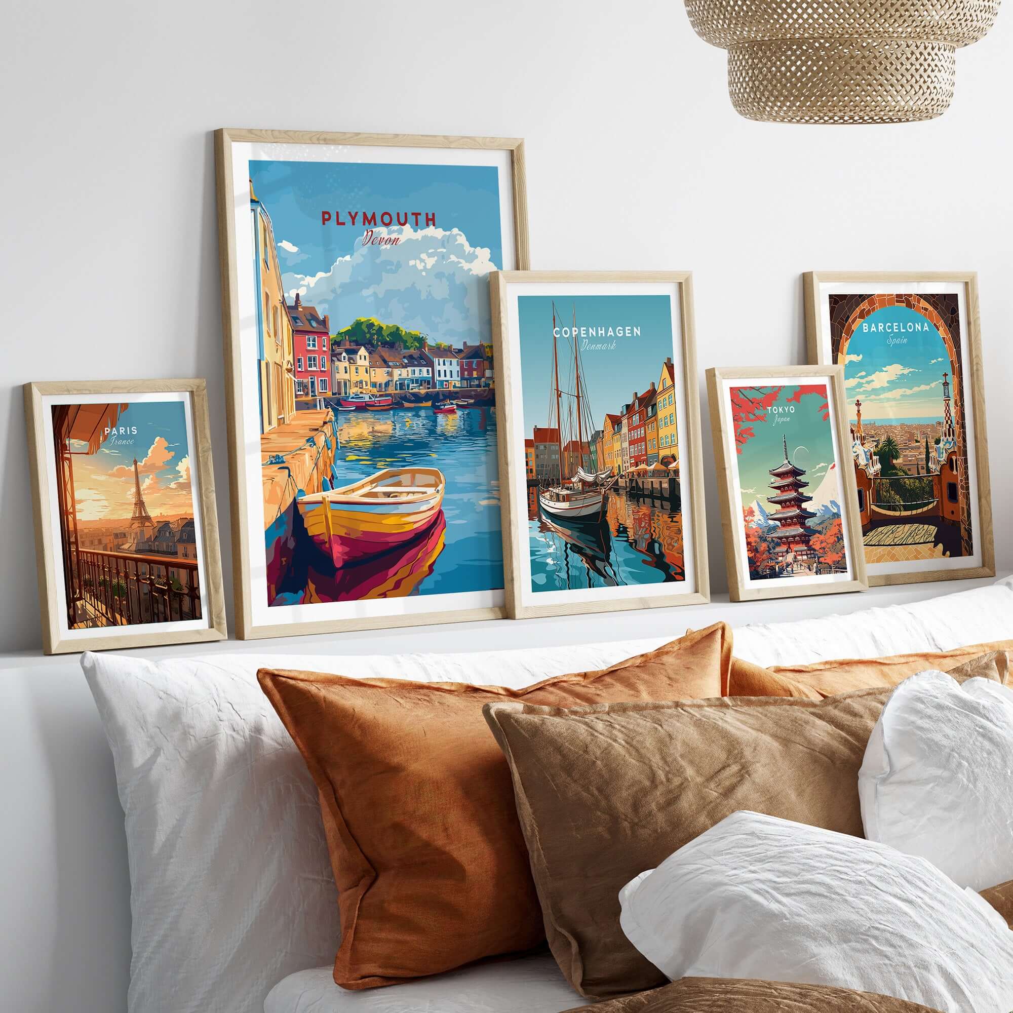 Plymouth Travel Poster displayed among other travel posters featuring vibrant harbour scenes and colorful cityscapes.
