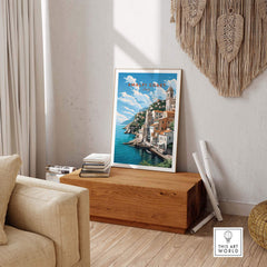 Amalfi Coast Italy travel poster showcasing pastel-colored landscape in a stylish home decor setting.