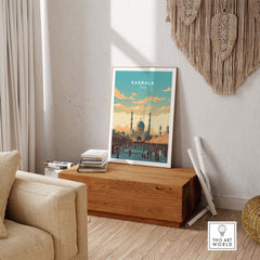 Karbala Iraq travel poster print displayed in a cozy living room with wooden decor and artistic elements.