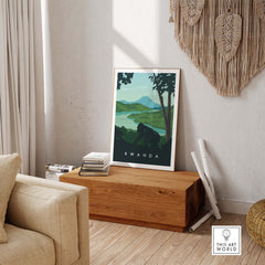 Rwanda travel poster print featuring mountain gorillas and scenic landscapes, ideal for safari-inspired decor.