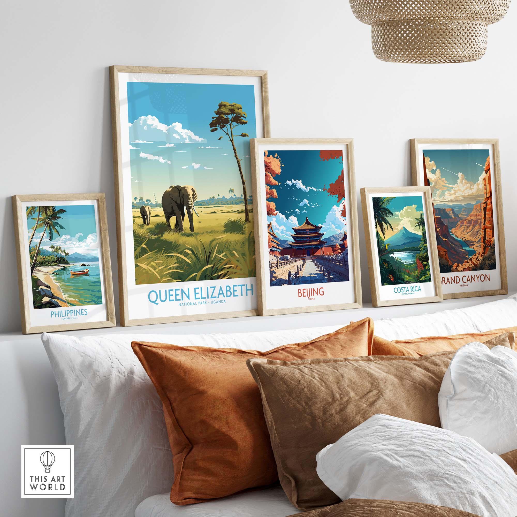 Framed travel posters featuring Queen Elizabeth National Park and other destinations in a stylish living room setting.
