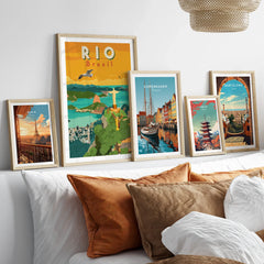 Framed travel posters of Rio, Paris, Copenhagen, Tokyo, and Barcelona for wall art decor