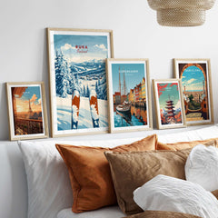 Beautiful Ruka Ski poster among other travel-themed prints on a cozy sofa, perfect for winter sports lovers.