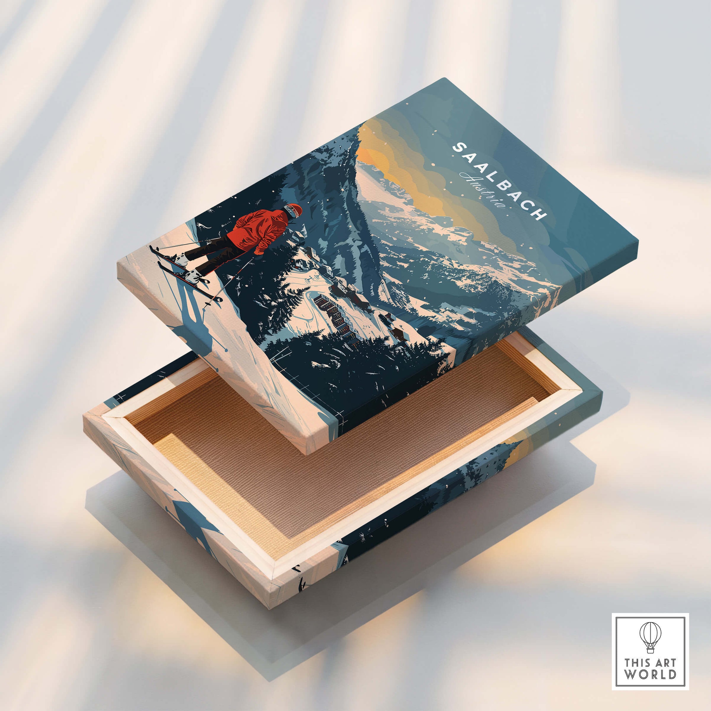 Saalbach Travel Poster - Austria on a decorative box showcasing scenic mountain views and a skier.