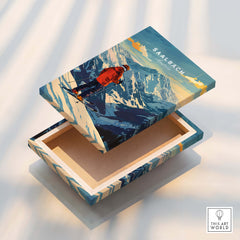 Saalbach Ski Poster- Austria on decorative box showcasing ski design and mountainous backdrop.