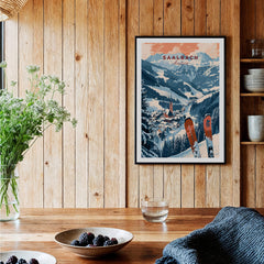 Saalbach Print Austria ski poster displayed in a cozy wooden interior with scenic mountain view.
