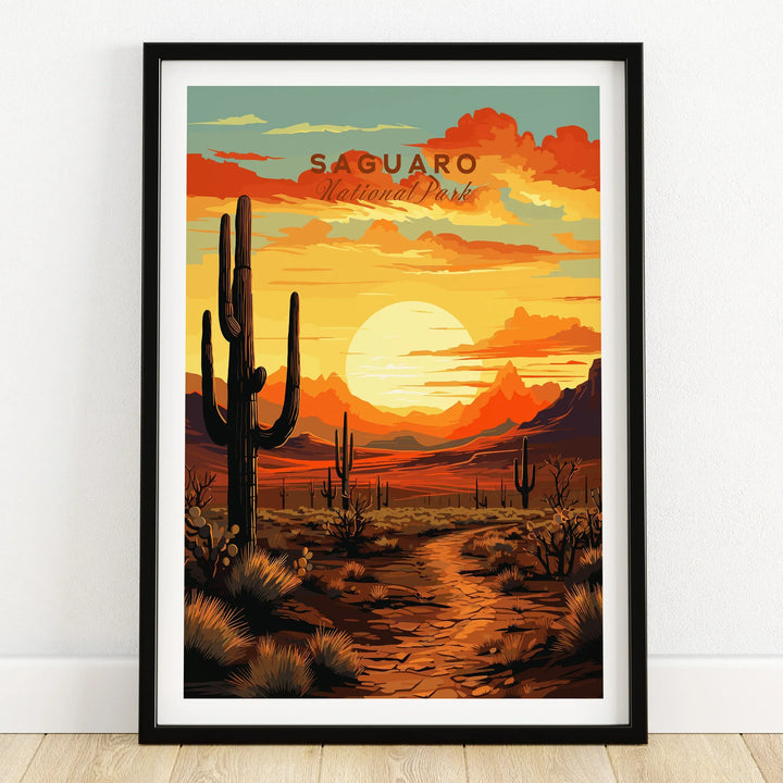 Saguaro National Park art print in black frame on wooden floor, sunset desert landscape.